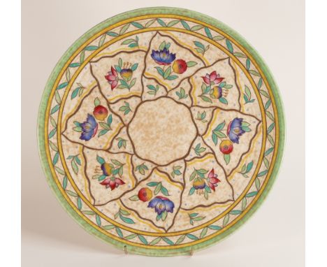 A Charlotte Rhead charger with floral and trellis patterns with green highlights. Backstamp to rear for Crown Ducal. Diameter