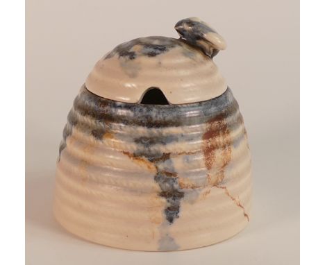 Clarice Cliff for Wilkinson, Beehive honey pot and cover in a Bizarre design. Height: 9.25cm