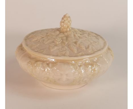 Belleek Pottery, a compressed circular powder pot and cover, lemon and white glazed over moulded vines, limited edition 403/1