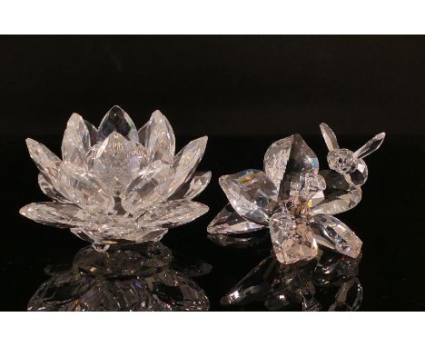 Two Swarovski Crystal models of flowers to include a candlestick and flower with bee. One boxed. (2)