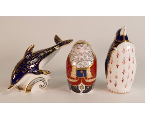 Three Boxed Royal Crown Derby paperweights to include Santa Claus, Dolphin and Penguin. Penguin is gold stopper, Santa and Do