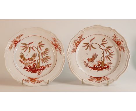 A pair of late 18th century Doccia plates. Painted in iron red with gilt highlights depicting two fighting cocks. Diameter: 2