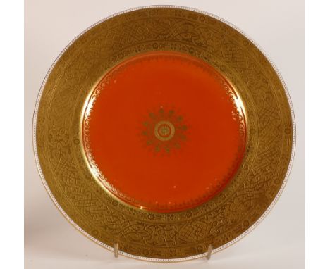 Mintons, heavily gilt Burnt orange ground cabinet plate. Raised gilt border in Eastern inspired patterns and gilt rim to base