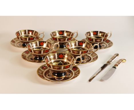 Royal Crown Derby Imari 1182 set of six tea cups and saucers (seconds) with two porcelain handled knives. (1 Tray)