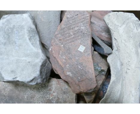 A collection of ancient pottery fragments and shards including part of a Medieval tile, part of a large Earthenware jug / Amp