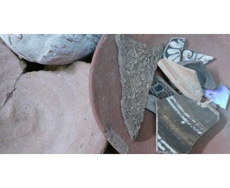 A collection of ancient pottery fragments and shards and Ethnographic items including Red Pottery bowls, reconstructed pots, 