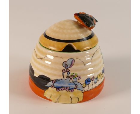 Clarice Cliff for Newport Pottery, small Beehive honey pot and cover decorated with a lone female figure in a flower meadow. 