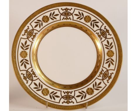 Mintons, heavily gilt cabinet plate. Raised gilt floral border. Diameter: 27cm