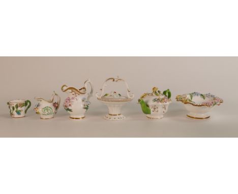 A group of six Coalbrookdale style encrusted porcelain items, a tea pot, handled basket, basin and jug, coffee can and small 