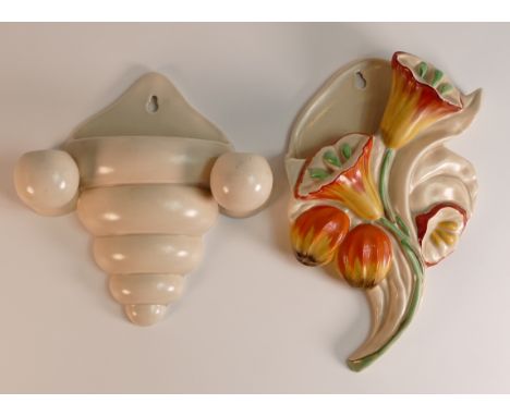 Clarice Cliff for Wilkinson Ltd. Bell Flower wall pocket together with Newport Pottery Co. ribbed wall pocket. Height of tall