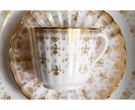 A large quantity of Spode gold Fleur de Lys tea and dinner ware to include - 18 trios, 19 dinner plates, milk jug, sugar bowl