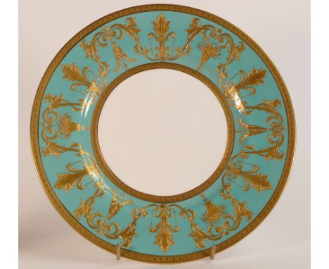 Mintons, heavily gilt turquoise ground cabinet plate. Raised gilt border and gilt rim to base. Diameter: 27cm
