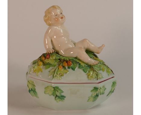 Henri Bargas for Royal Worcester, lidded box with modelled lid of a child and leaves. Puce backstamp and No. 3127 and hand pa