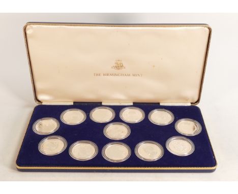 12 x 1980 hallmarked silver medallions, each weighing 25.6g, appx.  Cased.