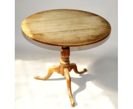 A 18thC oak and elm circular tripod table, with baluster column and cabriole legs, 82cm dia.