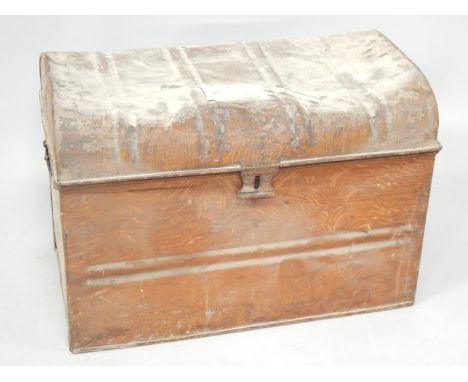 A Victorian tin trunk, with hinged lid, in a painted oak finish.