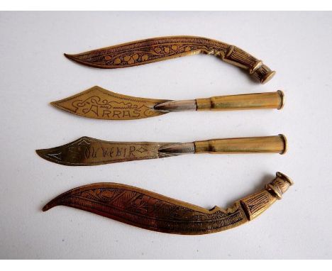 Two WWI trench art souvenir knives, one for St Omer and the other for Arras, and two brass novelty cookery style miniature kn