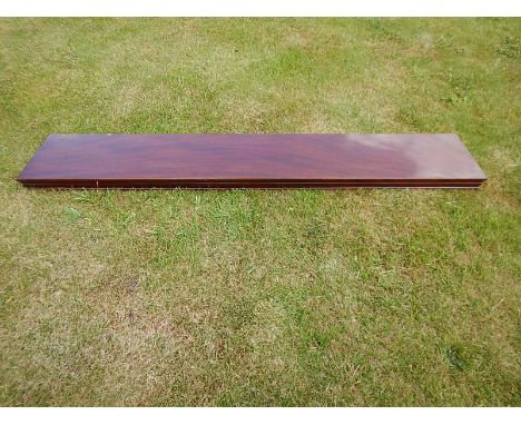 A figured mahogany shelf, with shallow moulded frieze, 146cm x 25.5cm.