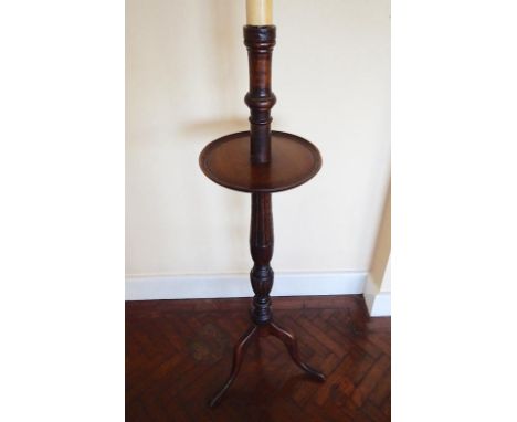 A Georgian style mahogany tripod standard lamp, with turned column and circular platform on cabriole legs, with shade.