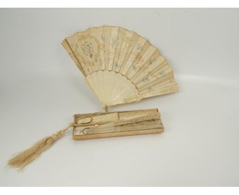 A Victorian bone and satin silk fan, with hand worked lace and needlework decoration of floral designs and two other Victoria