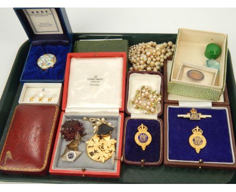 An enamel box, and a collection of costume brooches and gilt and enamel badges, etc.