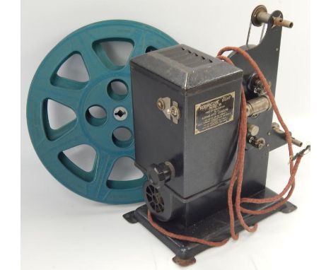 A Kodascope 8 Model 30 projector, with assorted spare reels.