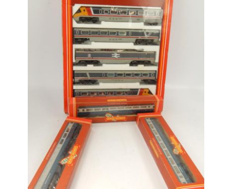 Model railway, Hornby Railways OO gauge scale models comprising three carriages and Advanced Passenger Train Pack set.