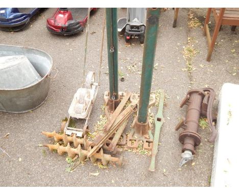 A set of vintage tennis ground equipment, including The Ladye Winder, patented by Hirst & Sons of Halifax, line marker, auger