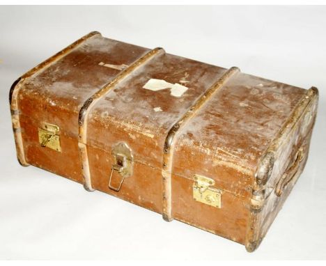 A vintage canvas bound cabin trunk, with brass fittings.