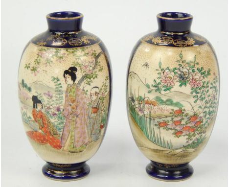A small pair of early 20thC Japanese satsuma vases, decorated with figures in a landscape with Mount Fuji, in polychrome enam