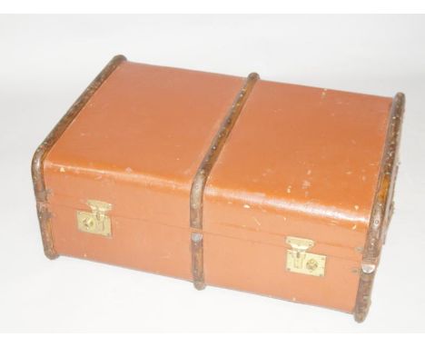 A vintage canvas bound cabin trunk.