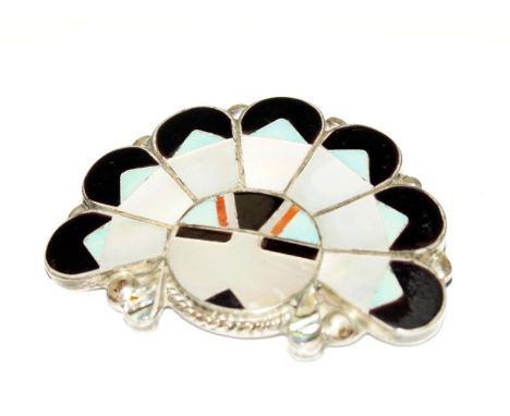 A white metal and enamelled and mother of pearl brooch, in the form of a Indian chief and headdress, the reverse inscribed Ma