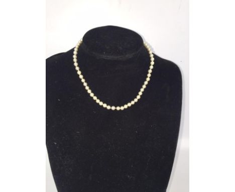 A cultured pearl necklace, with globe and clasp style fastening in yellow metal marked HS, total length 37cm.