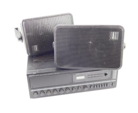 An InterM PAM120 public address amplifier, with a pair of Peavey electronics wall mounting speakers.