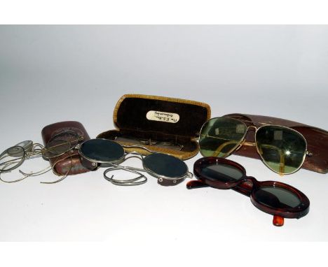 A pair of Bausch & Lomb Ray-Ban vintage sunglasses, in original leather case, two other pairs of sunglasses, two pairs of pin