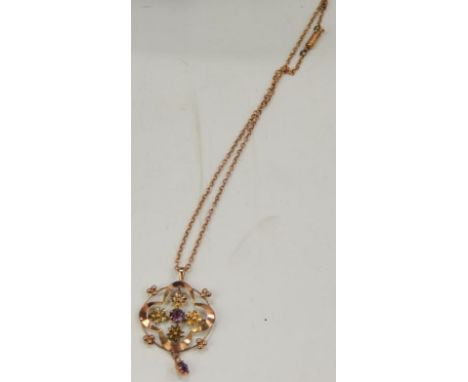 An Art Nouveau pendant and chain, the circular pendant with amethysts and seed pearl, with fine link chain, yellow metal, mar
