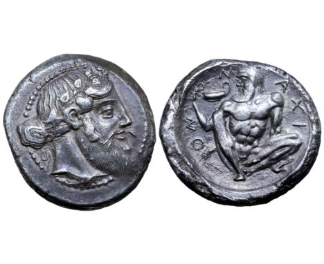 Sicily, Naxos AR Tetradrachm. Circa 460 BC. Bearded head of Dionysos right, wearing ivy wreath, his hair tied in a krobylos b