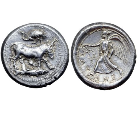 Sicily, Katane AR Tetradrachm. Circa 465-450 BC. The river god Amenanos as a bearded, man-headed bull kneeling to right, fish