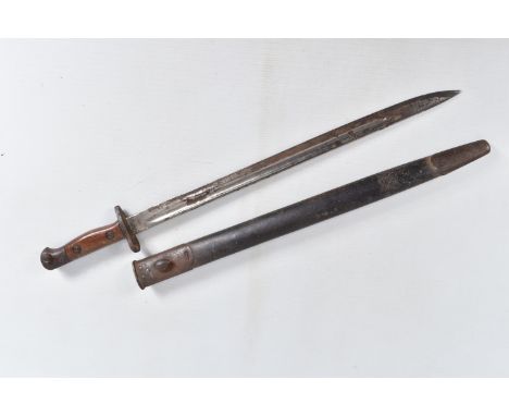 A 1907 PATTERN BRITISH SWORD BAYONET, this comes complete with a scabbard, the blade has markings on it near the hilt but som