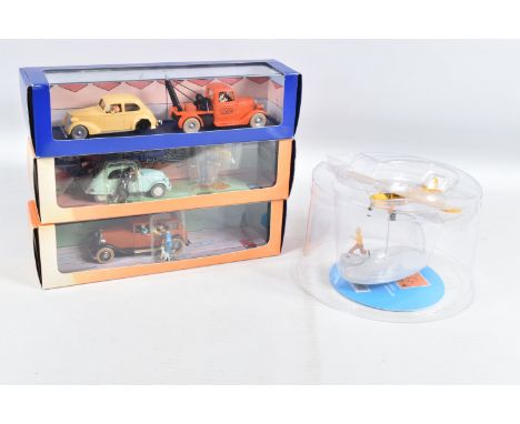FOUR BOXED HERGE MOULINSART EN VOITURE TINTIN MODELS, to include a Album Les Cigares du Pharaon L'avion Orange Planches 32 a 