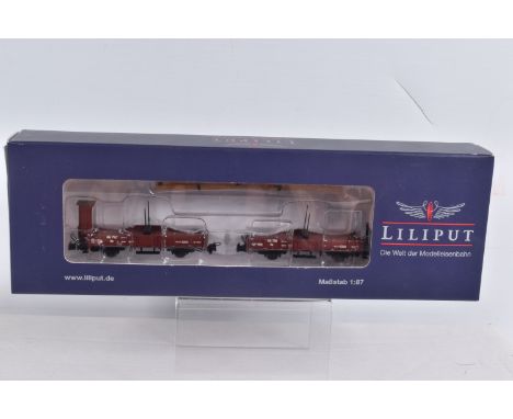 A BOXED LILIPUT HOe GAUGE TWIN PIVOT WAGON with Timber Load, model no. L240100, appears in new condition with accessories and