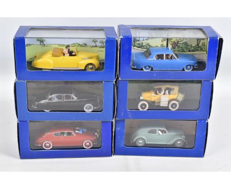 SIX BOXED EN VOITURE TINTIN MODEL VEHICLES, the first is a Le Taxi Bleu de Lile Noire 1984, numbered 2 118 045, the second is