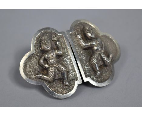 A Far Eastern White Metal Belt Buckle decorated in Relief with Thai Dancers 