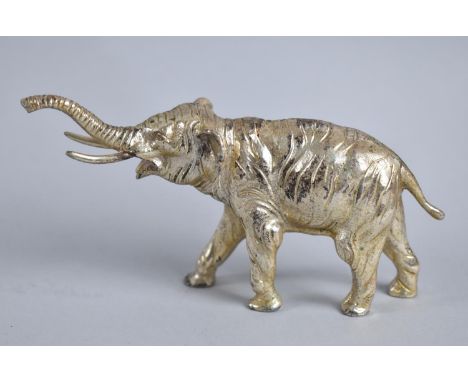 A Heavy Silver Plated White Metal Study of Elephant with Trunk in Salute, 14cms Long 