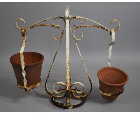 A Wrought Metal Flower Pot Stand in the Form of Balance Scales, 51cms High 