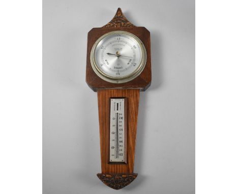 An Art Deco Wall hanging Aneroid Barometer by GW Harvey, Wellington, 37cms High 