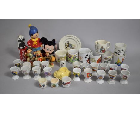 A Collection of Various Late 20th Century Childrens Egg Cups with various Designs and Cartoon Characters to include Tom and J
