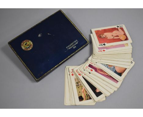 A Set of Risque Playing Cards in Vintage Players Navy Cut Tin 
