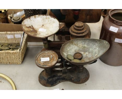 Two sets of metal scales and weights 