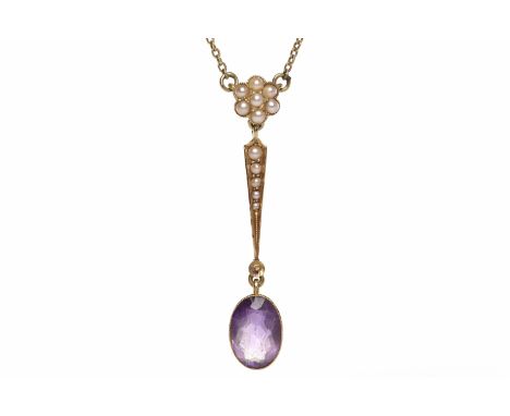 EDWARDIAN FIFTEEN CARAT GOLD AMETHYST AND SEED PEARL NECKLETformed by a single oval amethyst 10mm long and within a millegrai